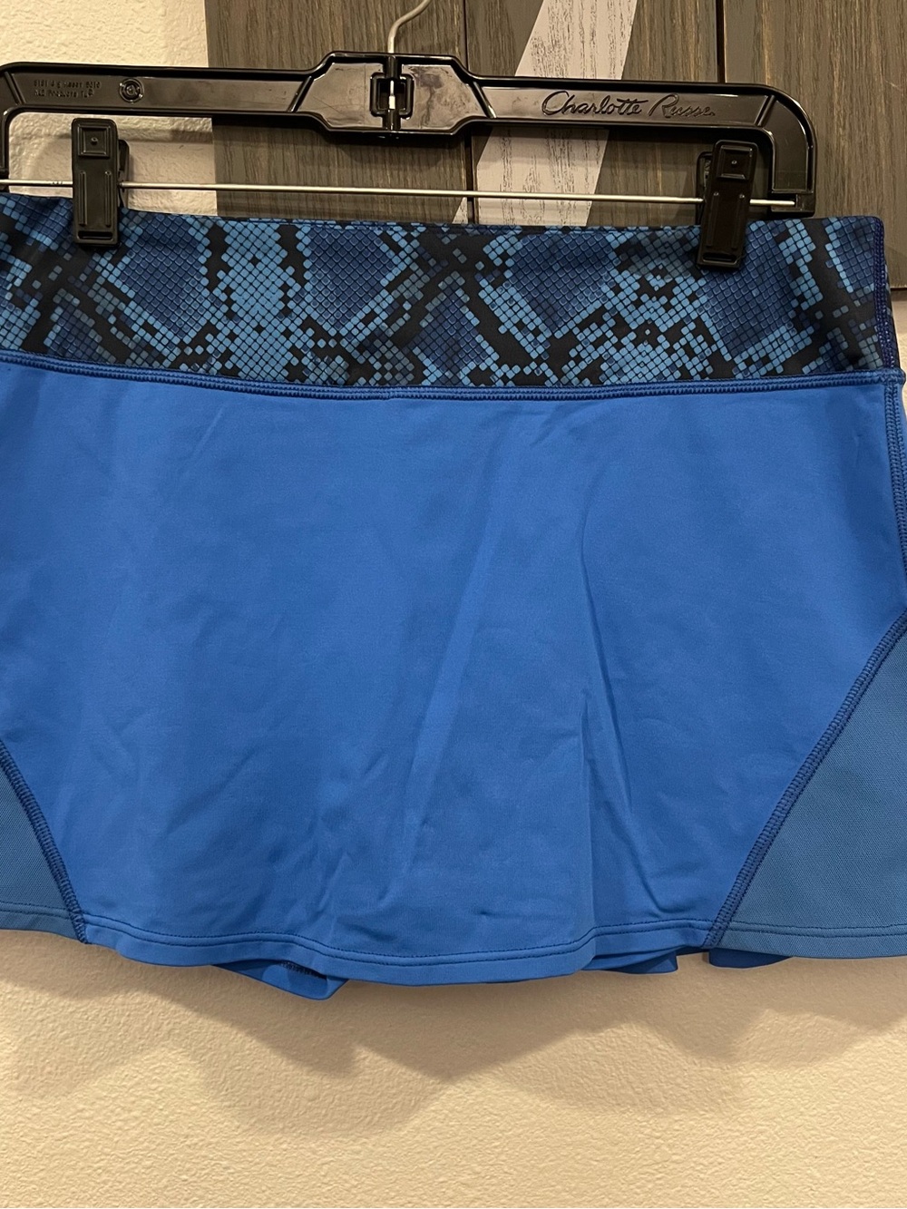 Women's Blue Athletic Skirt with Snake Print Trim.